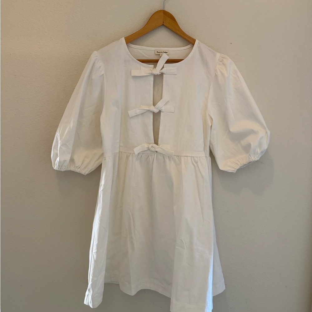 Charming White Dress with Bow Accents